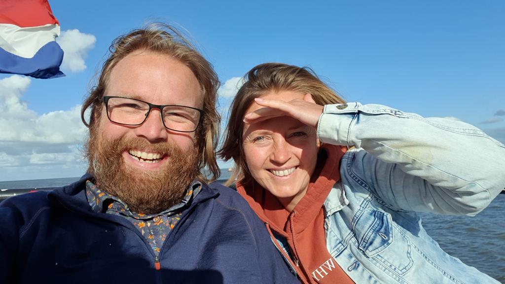 Adija and Sacha smiling together on the water