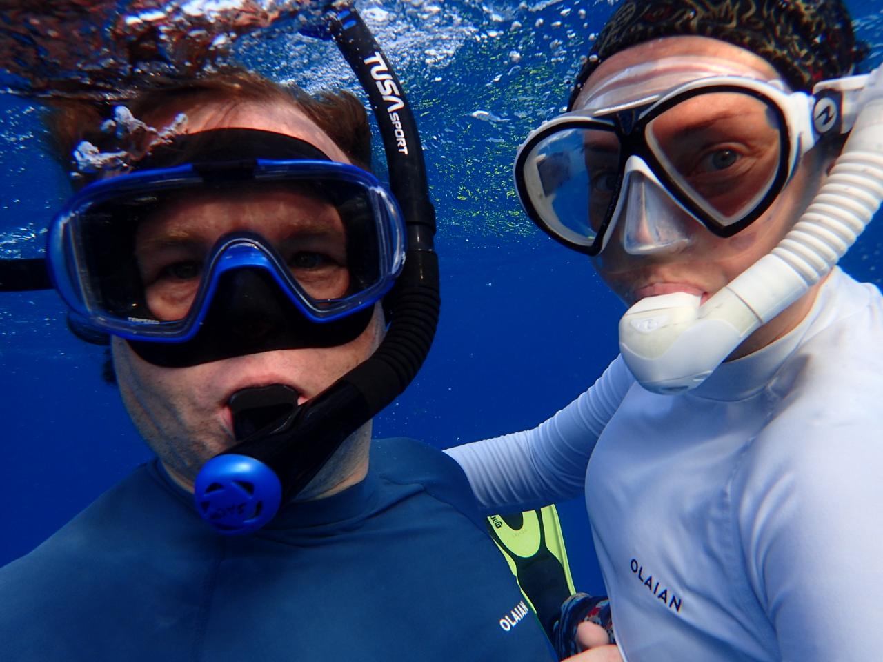 Adija and Sacha snorkeling together underwater